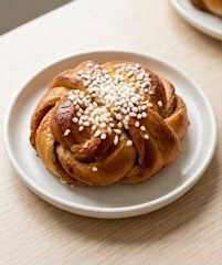 Kanelbullar — classic Swedish cinnamon bun with pearl sugar